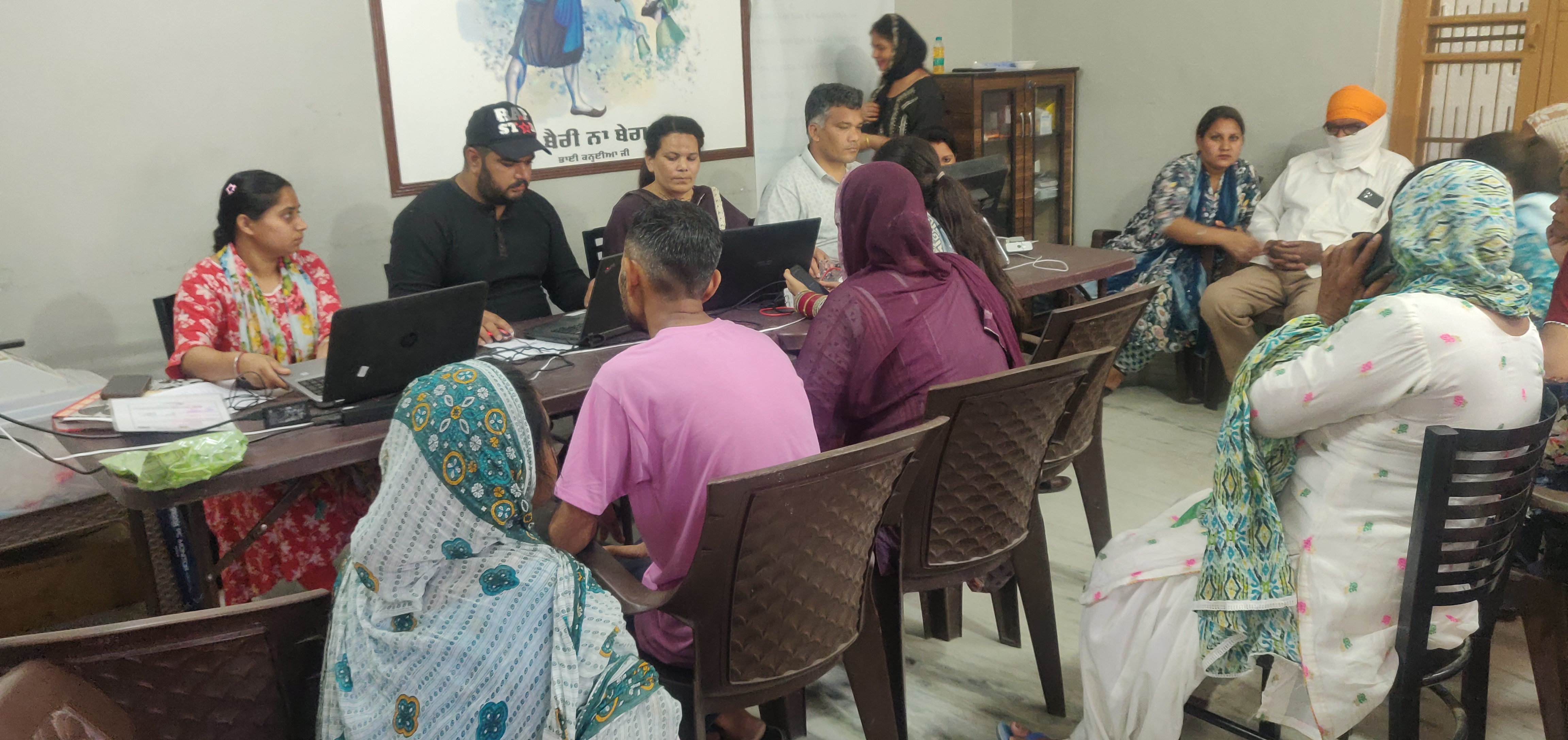 Young people in rural Punjab learning computer skills in a bright village IT lab